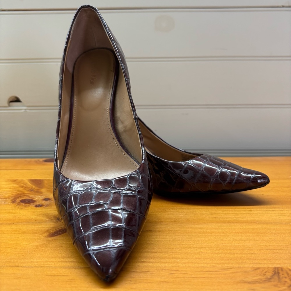 Calvin Klein “Gayle” Cabernet Patent Croco Leather Cocoon Pump.
